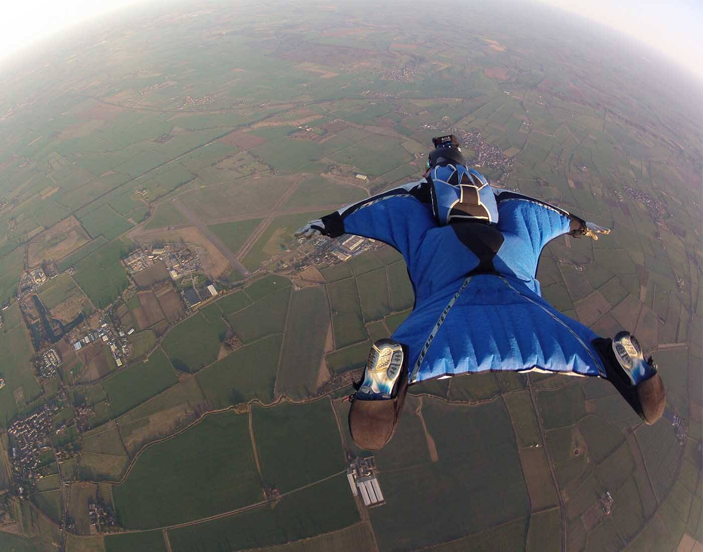 alto adventure wingsuit in between 2 separate grinds