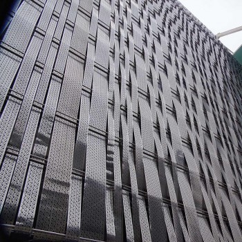 Facade coated with drilled stainless steel