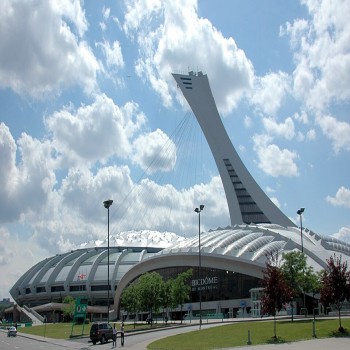 Montreal Biodome in front of Olympic Stadium and its tower