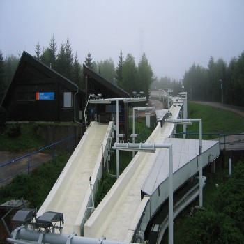 Woman's single luge start house (left). Track (right) leads uphill through turns #2 and #1 to men's single luge and bobsleigh-skeleton start houses.