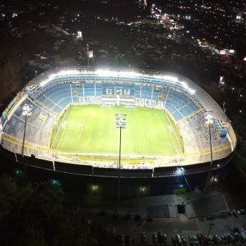 An aerial view of the Cuscatlan Stadium at night, with all its lighting