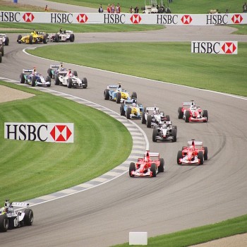 Cars wind through the infield section at the start of the 2003 United States Grand Prix.