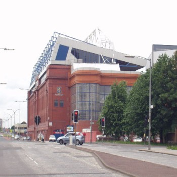 A view of the Main Stand in 2005. The Club Deck (white) was constructed above the 1928 Main Stand in the early 1990s. The brick and glass construction in front is an enclosed stairwell to the upper deck.