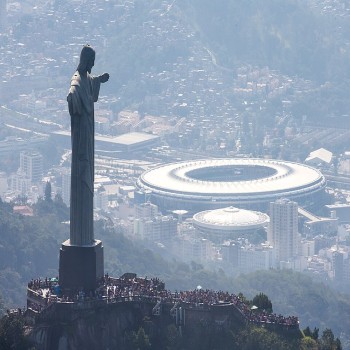 Christ the Redeemer in the foreground and Maracanã and Maracanãzinho in the background .