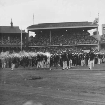Ron Clarke carrying the Olympic Torch through the MCG at the 1956 Olympic Games' opening ceremony.
