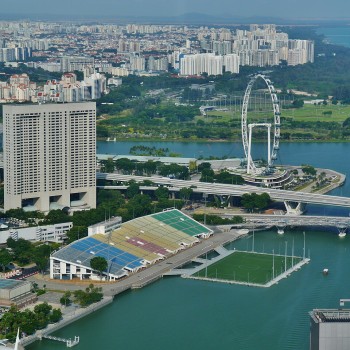 The 27,000-capacity grandstand and floating platform of The Float@Marina Bay, with the Singapore Flyer in the background.