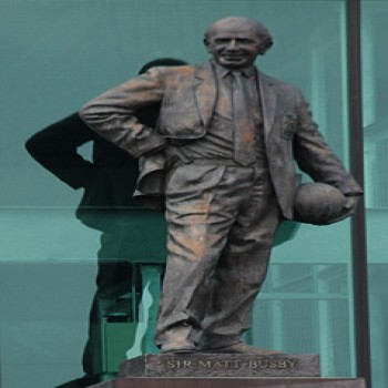 The statue of Sir Matt Busby overlooking the East Stand forecourt
