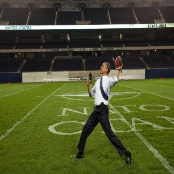 Former President Barack Obama throws a football at Soldier Field after the 2012 NATO summit