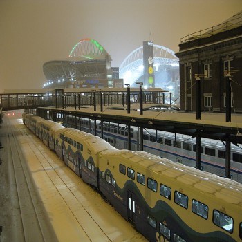 A Sounder commuter train and Amtrak's Coast Starlight at nearby King Street Station after a Seahawks game in 2008
