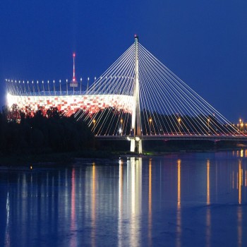 Night view of the National Stadium and the Świętokrzyski Bridge from the left bank of the Vistula
