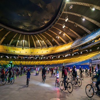 Cyclists ride inside the stadium during the 2019 Tour la Nuit