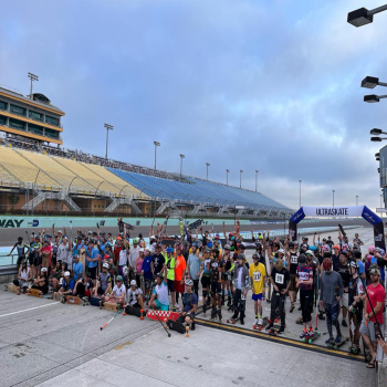 A group of skaters, longboarders and inline skaters, line up at Homestead Miami speedway to race at Miami Ultraskate 2022.